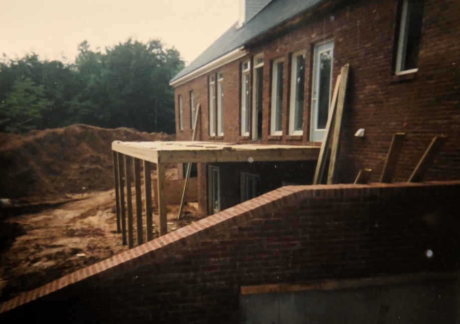 the beginning of a second-story deck on wooden beams